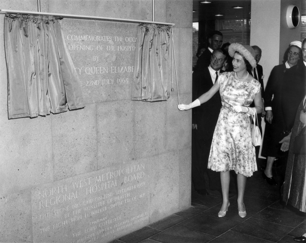 Queen Elizabeth II unveiling a commemorative stone to mark the official opening of the QEII Hospital on 22 July 1963. Queen Elizabeth II