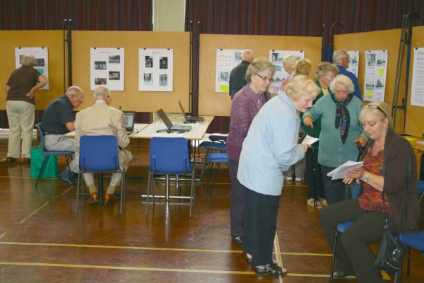 Summer Show visitors viewing exhibits, exploring online resources and giving feedback via a comments board